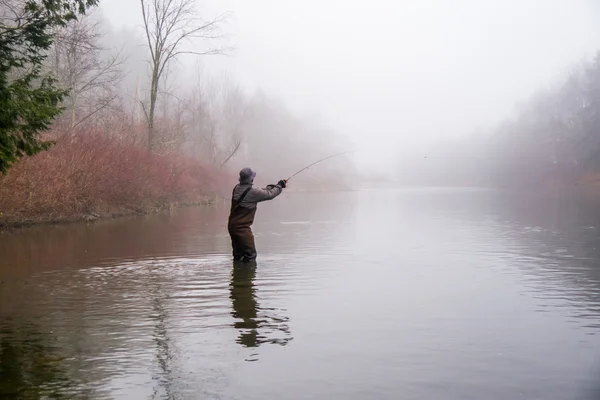 Man fishing in a river — Stock Photo, Image