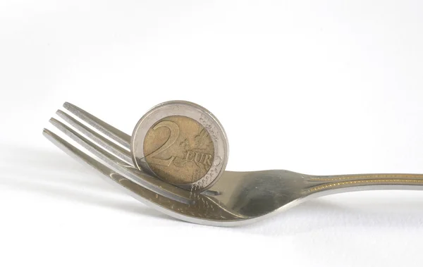 Dinero céntimos de euro y tenedor para comer — Foto de Stock