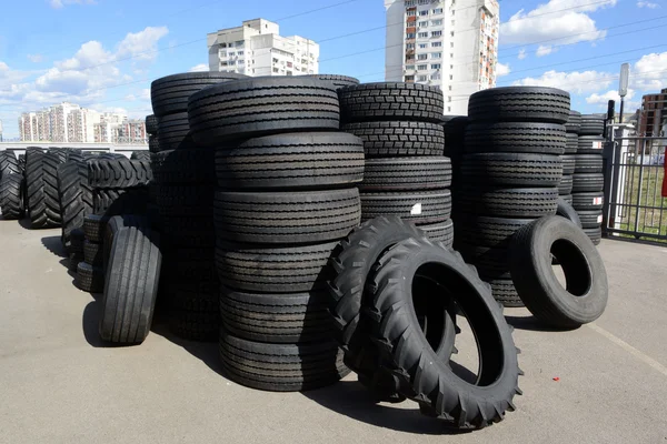 Tires stacked in a yard