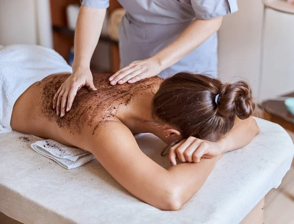 Young atractive female in massage salon is having beauty and healthcare procedures