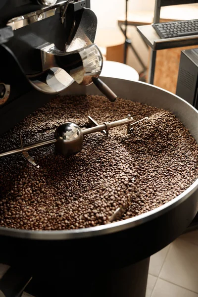 Coffee processing. Roastery, roasting machine and fresh beans