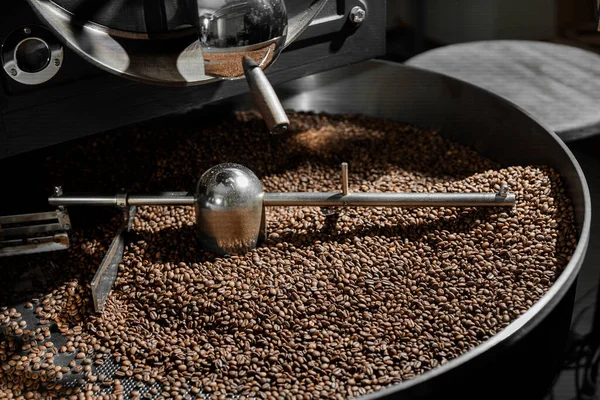 Coffee processing. Roastery, roasting machine and fresh beans