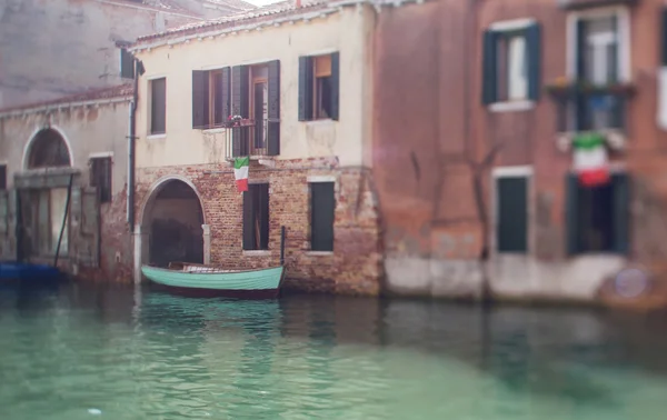 Tilt shift photo of Venice street with boat. Soft focus — Stok fotoğraf
