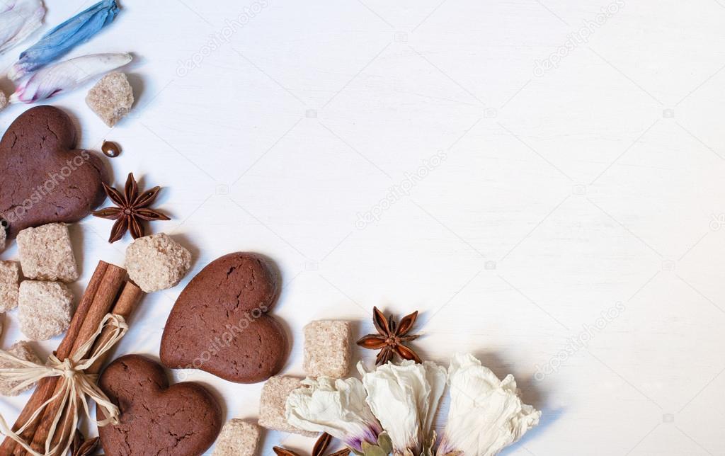 Chocolate cookies, brown sugar, anisetree and cinnamon on white 