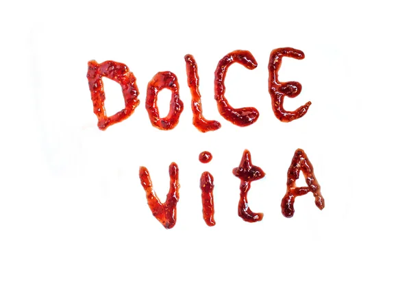 Italian frase "dolce vita" (sweet life) spelling with jam — Stock Photo, Image