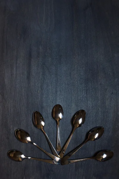 Some spoons on dark background — Stock Photo, Image