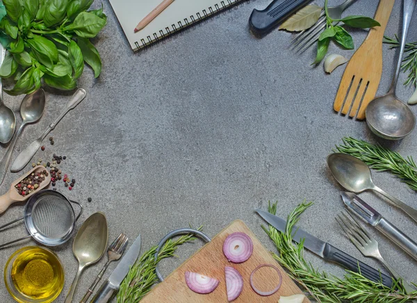 Antique cutlery with condiment, herb and olive oil on grey stone — Stock Photo, Image