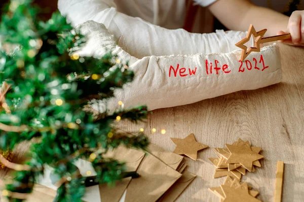 boy with plaster cast on his arm makes Christmas crafts. Hand fracture and injury. Removes plaster cast, waiting for a new life. New year and new plans.