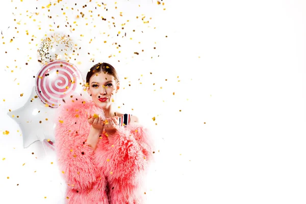 Funny woman celebrating with air balloons isolated white. Shows hand okay. in a pink fur coat, golden tinsel.Vivid emotions, surprise and joy, laughter and scream.Birthday holiday party — Stock Photo, Image