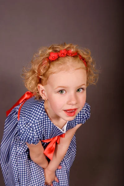 Emotional portrait of a cheerful blonde curly. — Stock Photo, Image