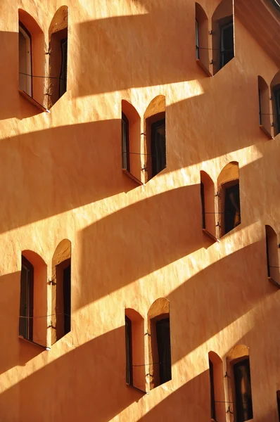 Long shadows of window shades