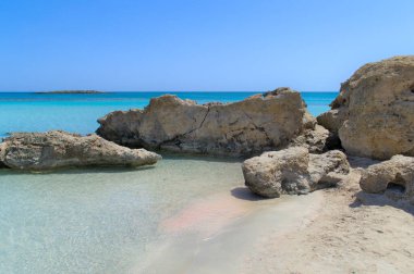 A tropical paradise beach with white sand and crystal clear ocean waters.