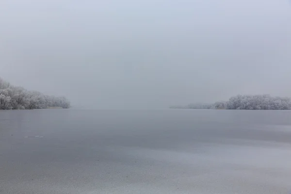 Lonely island.ice on the lake — Stock Photo, Image