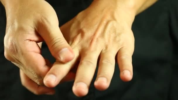 Man Massaging His Hands Studio — Stock Video