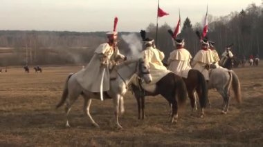 Russian cavalrymen attack French horsemen near the Berezina River, soldiers fire guns and rifles; Belarus, November 14, 2020.