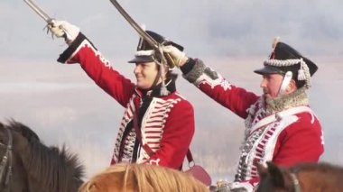 Russian cavalrymen attack French horsemen near the Berezina River, soldiers fire guns and rifles; Belarus, November 14, 2020.