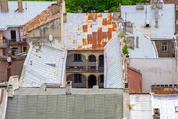 Texture of urban old roofs of a European city, top view.