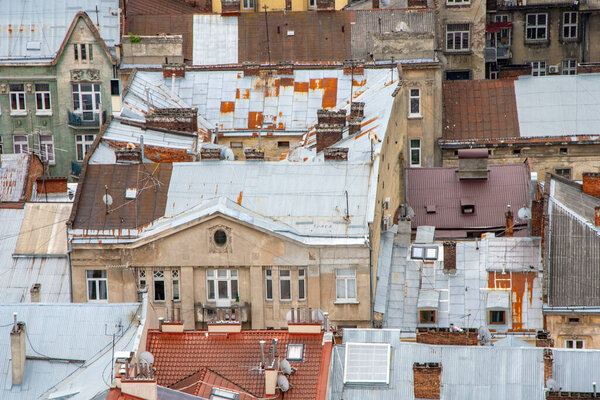 Texture of urban old roofs of a European city, top view.