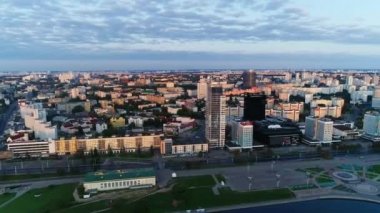 Earlier in the morning, summer. Panoramic view from the height of the city residential quarters in the center of Minsk. Belarus. Pobediteley Avenue, Svisloch River.