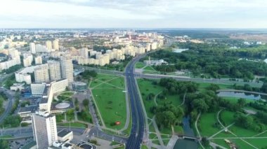 Earlier in the morning, summer. Panoramic view from the height of the city residential quarters in the center of Minsk. Belarus. Pobediteley Avenue, Svisloch River.