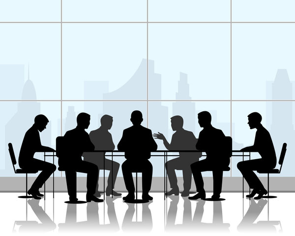 Бизнесмены за столом переговоров
