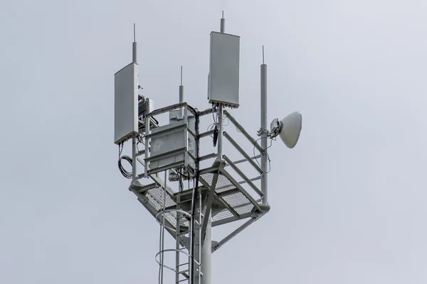 Cellular tower on the blue sky background — Stock Photo, Image