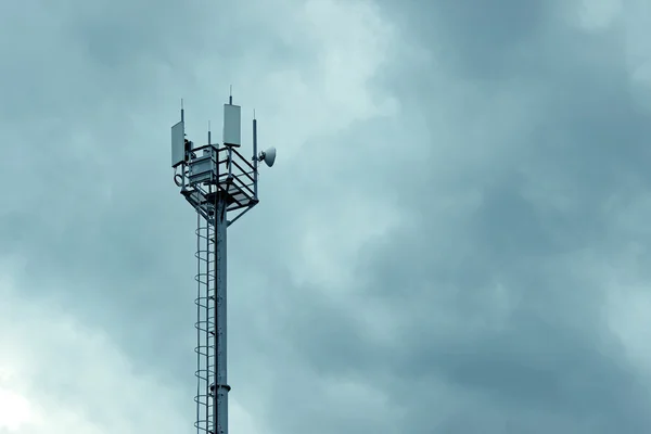 Cellular tower on the blue sky background — Stock Photo, Image