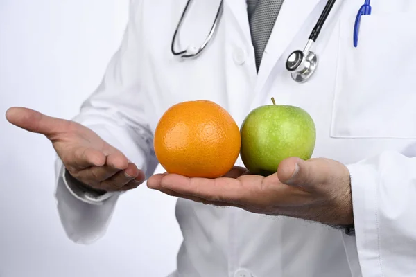 Health concept. Nutritionist doctor advises us to eat fruit. Healthy diet.