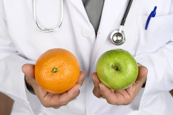 Health concept. Nutritionist doctor advises us to eat fruit. Healthy diet.