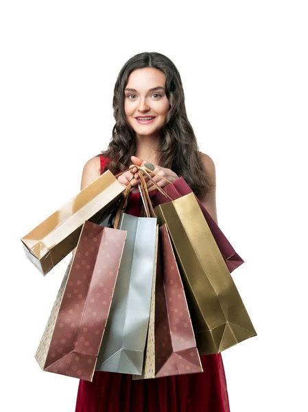 Mosolygó fiatal nő, bevásárló táskák — Stock Fotó