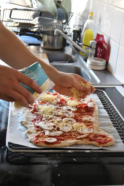Man Putting Cheese Pizza Cooking Food Kitchen — Stock fotografie