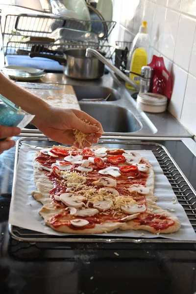 Man Putting Cheese Pizza Cooking Food Kitchen — Stock Fotó