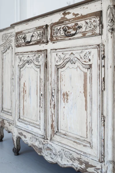 Close-up of ancient white commode bureau furniture with paint peeled off — Stock Photo, Image