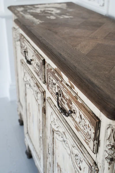 Close-up of ancient white commode bureau furniture with paint peeled off — Stock Photo, Image