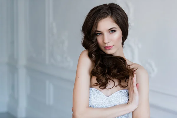 stock image Girl shows hairstyle. Cheerful bride holding her curly hair.