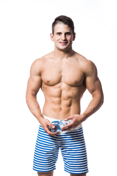 Fitness man holding a bottle of fresh water isolated over white background — Stock Photo, Image