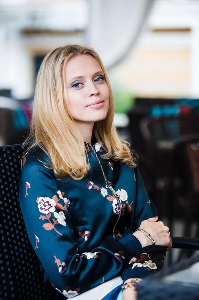 Young gorgeous European woman with pretty face thinking about something while sitting with laptop computer in cafe bar, dreamy beautiful female using portable net-book during work break in coffee shop