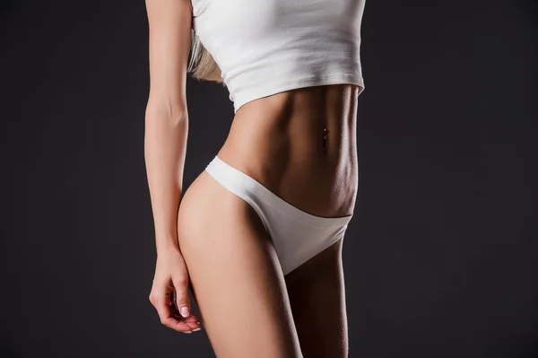 Imagen de cerca de la mujer entrenados abdominales —  Fotos de Stock