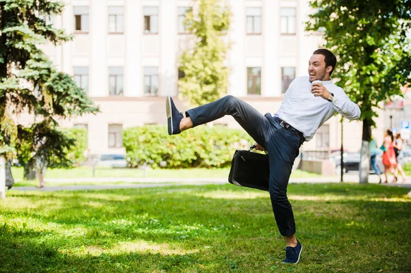 Business man runs in the park outdoors. Late for work — Stock Photo, Image