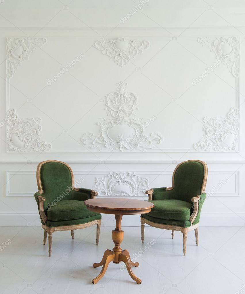 Portrait Of Vintage Vanity Table Set With Stool Over Wall