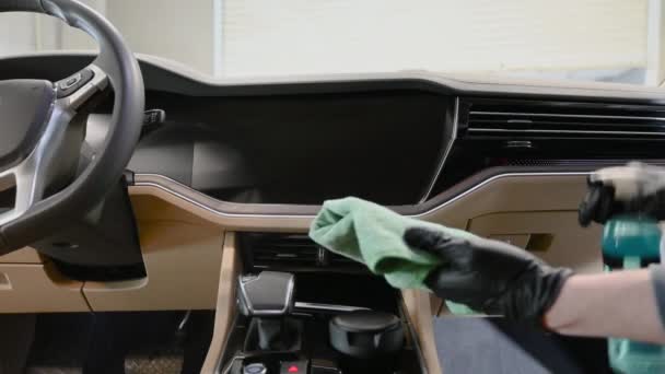 A man cleaning car interior with microfiber, car detailing and valeting concept. — Stock Video