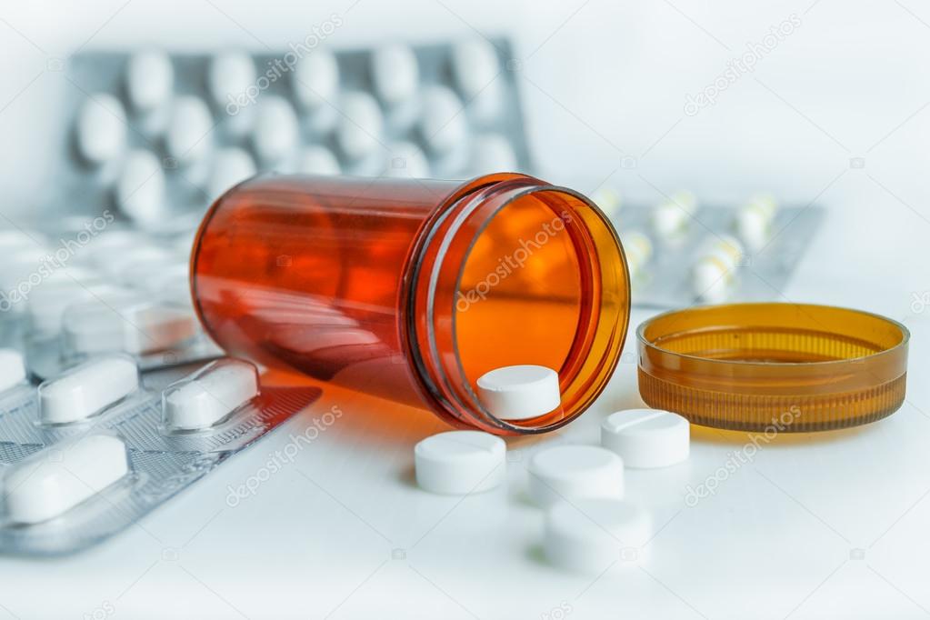 pills in pill bottle with blister pack medicine