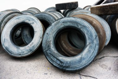 tires heap on cement ground, used car tires clipart