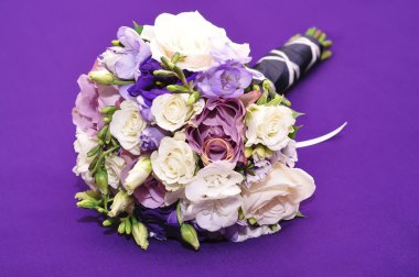 Bridal bouquet on a purple background
