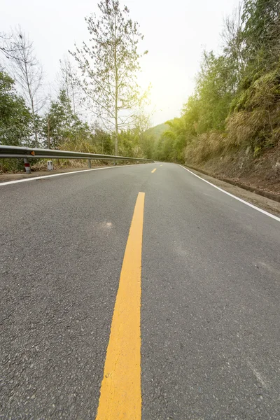 Kronkelende weg achtergrond — Stockfoto