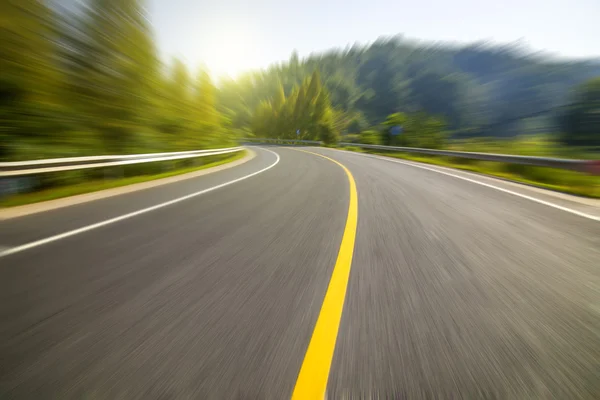 Highway spiral road on sunset — Stock Photo, Image