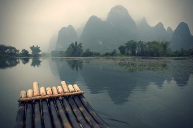 bamboo rafting in Yulong River clipart
