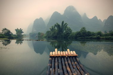 bamboo rafting in Yulong River clipart
