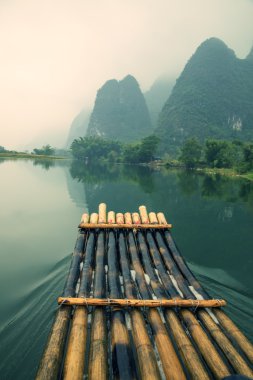 bamboo rafting  in Yulong River clipart