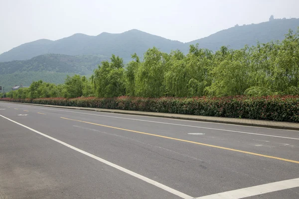 Camino de montaña al atardecer china — Foto de Stock